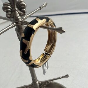 Sequin brand black enamel and gold textured starfish motif hinge bracelet